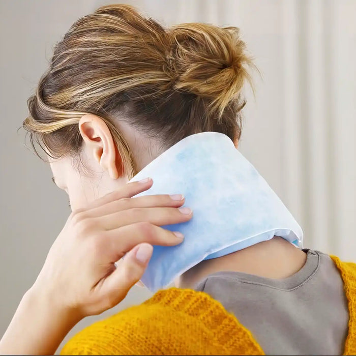 person using heating pad on low setting for 20 minutes, towel barrier between pad and skin, timer on clock