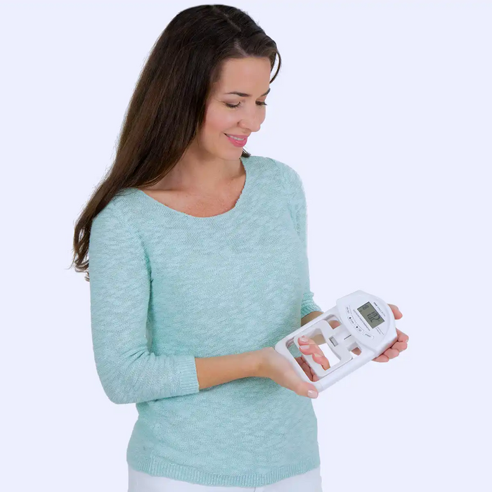 Woman holding grip strengthener