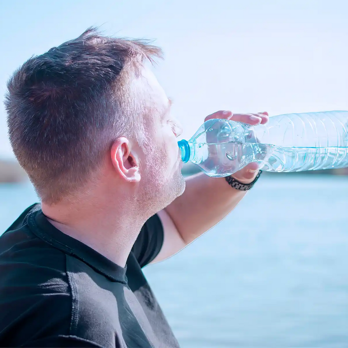 man drinking water