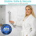 ADA compliant grab bar supporting up to 440 pounds, providing stable, safe, and secure support for bathroom use, shown with a person in a bathrobe.